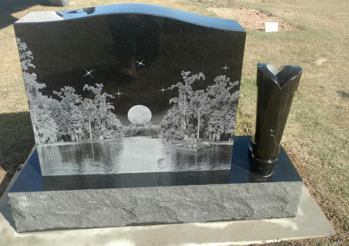 For highly detailed pictures you can have them lasered onto your memorial, black is the best color for this option.  This family even added a cowboy boot vase for their loved one.